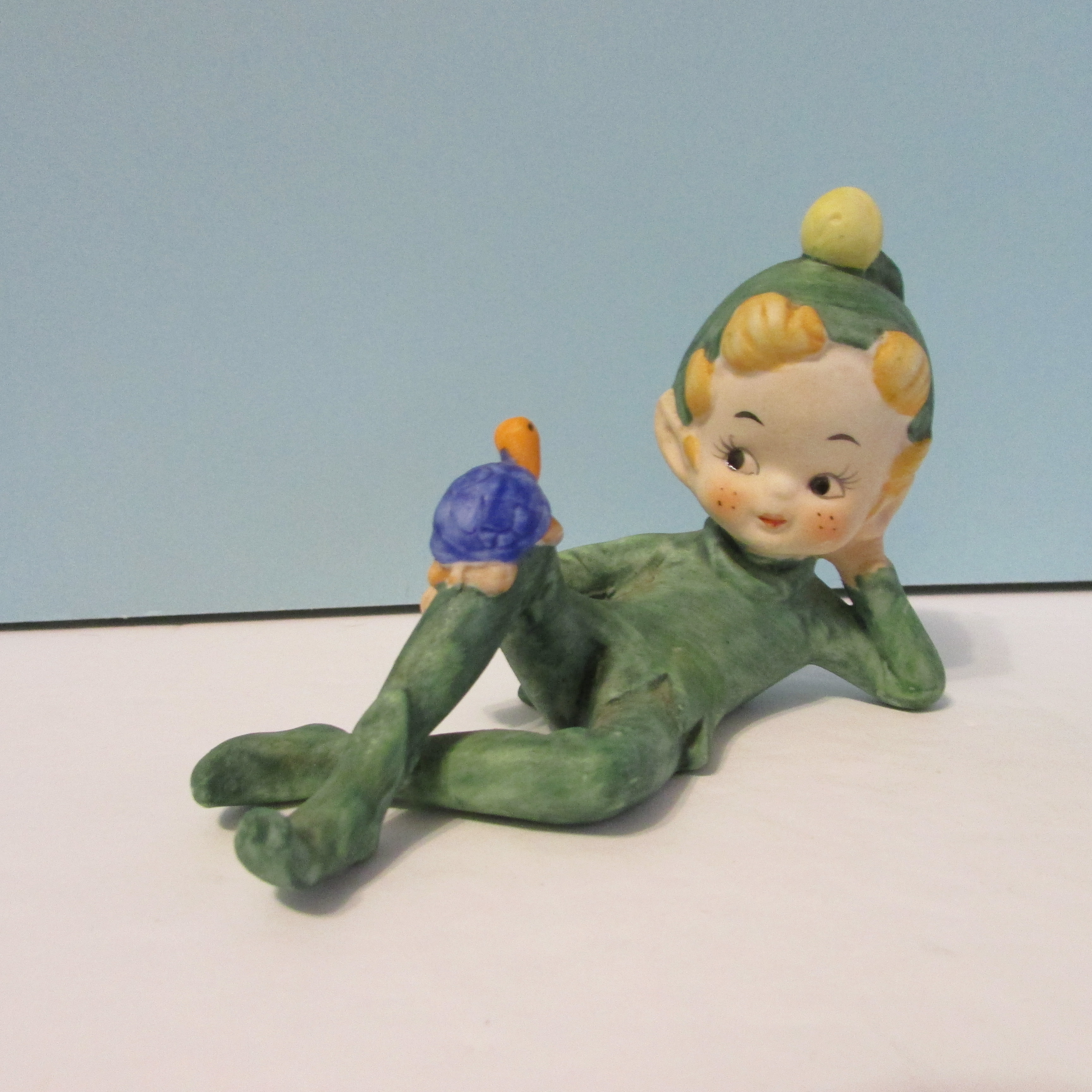 vintage laying Kelvin pixie with turtle figurine green elf