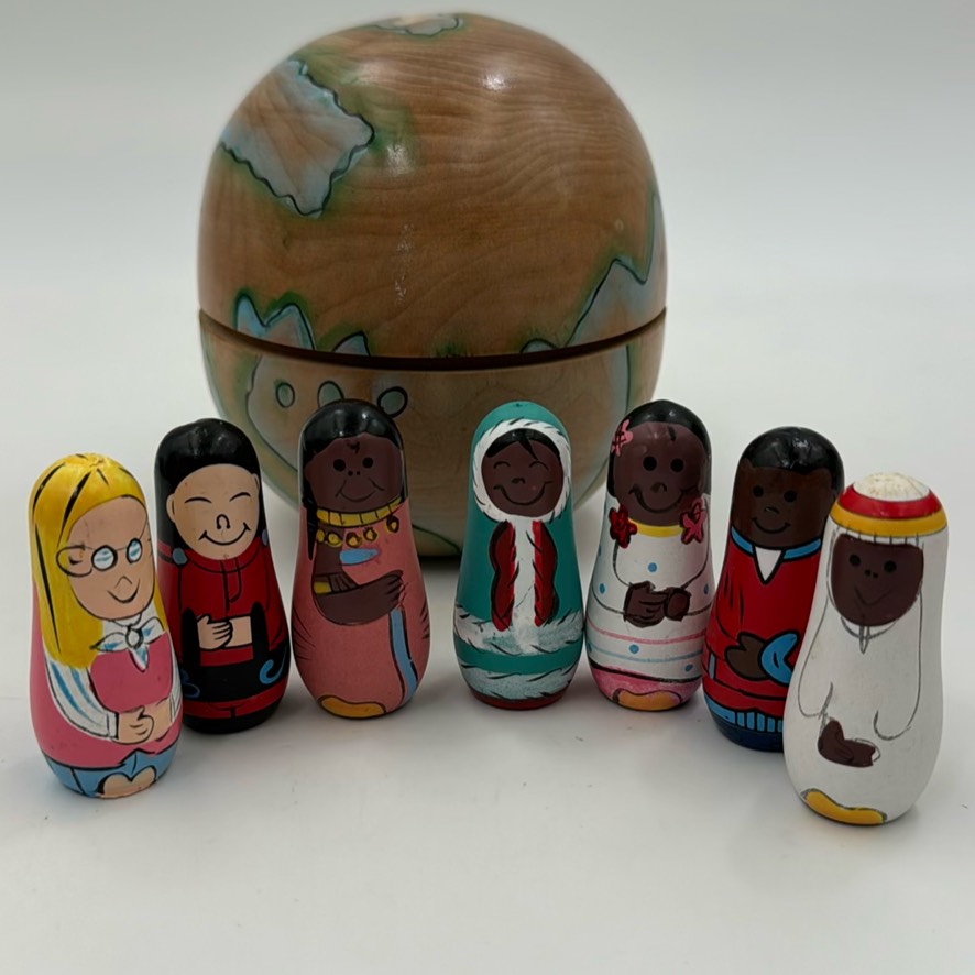 Wooden World Globe With Seven Nesting MultiCultural Dolls.