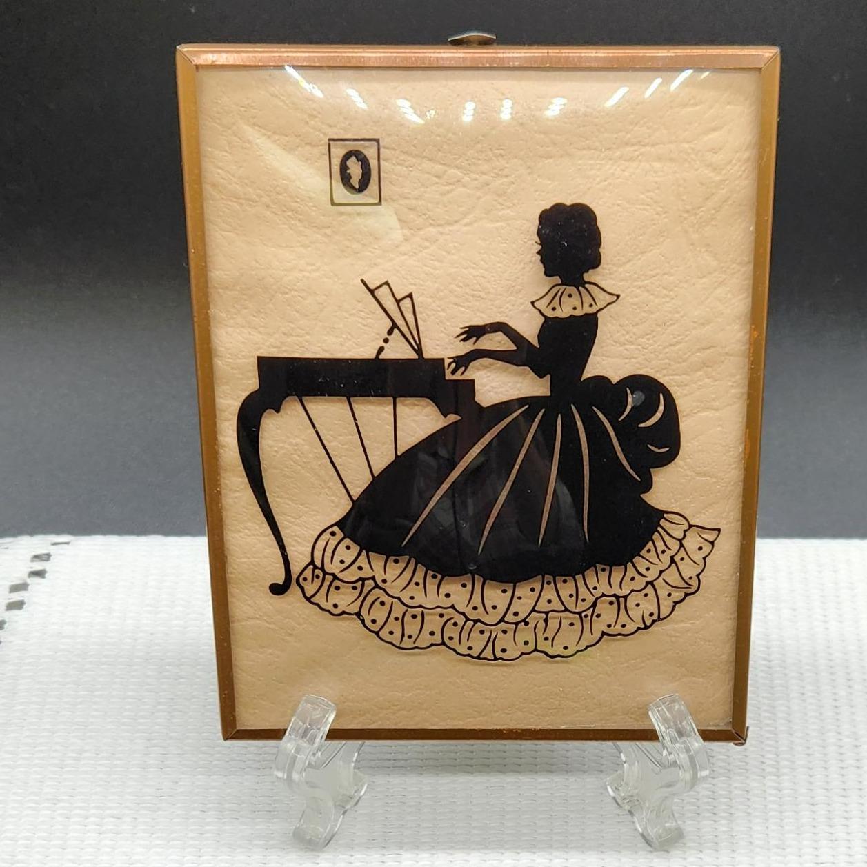 Convex Glass Reverse Painted Silhouette of Victorian Girl Playing the Paino