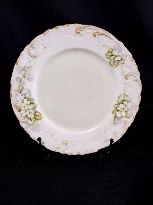 Plat ancien en porcelaine de Limoges, France